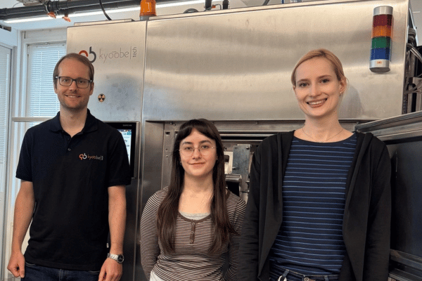 image for the article: Successful Factory Acceptance Test (FAT) of eFIT, showing three KyooBe employees participating in the FAT.